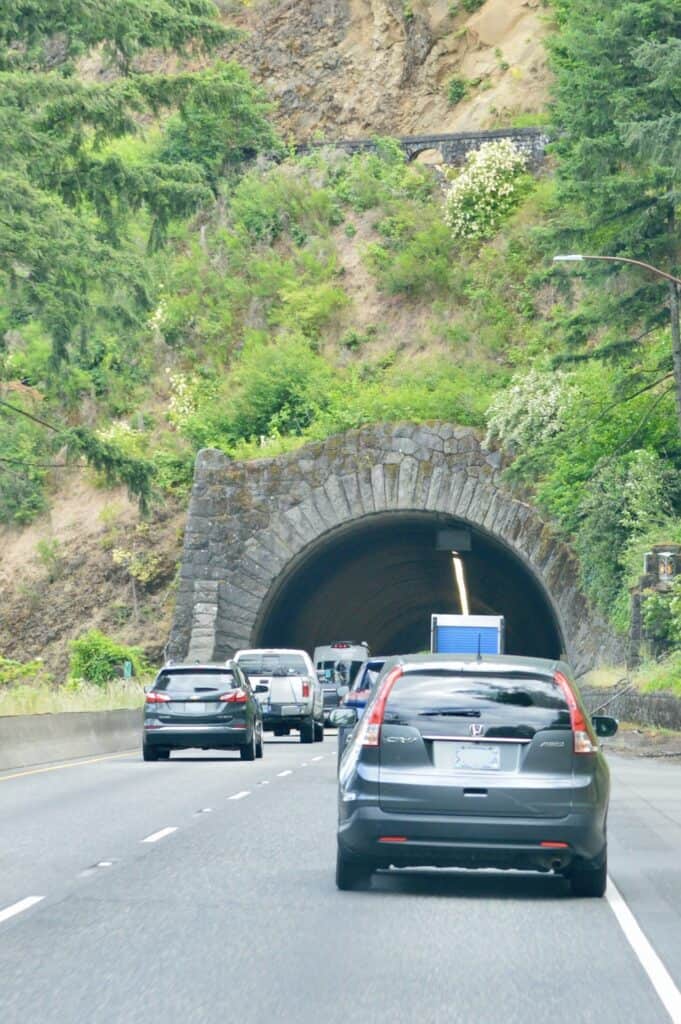 Cars entering tunnel.