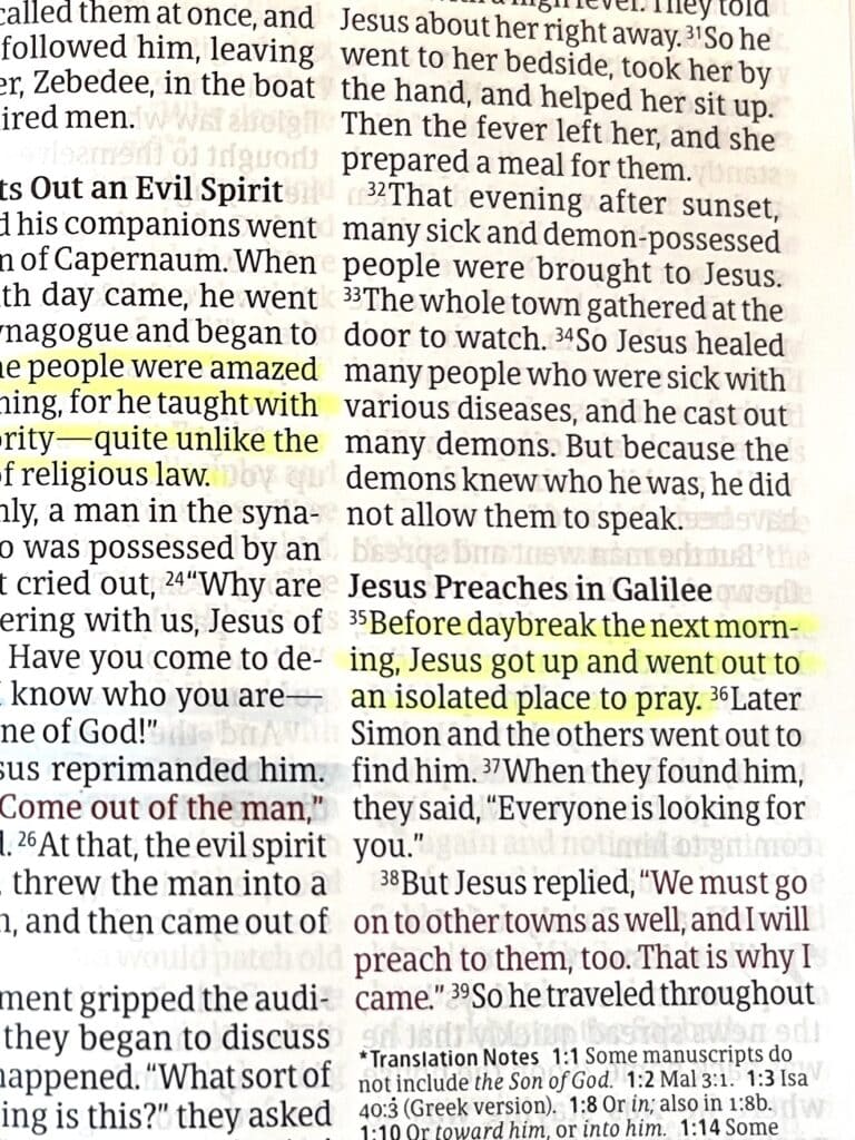 Photo of NLT Bible page with Mark 1:35 highlighted in yellow