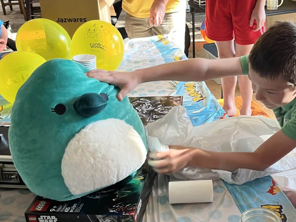 Our son opens a birthday Squishmallow.