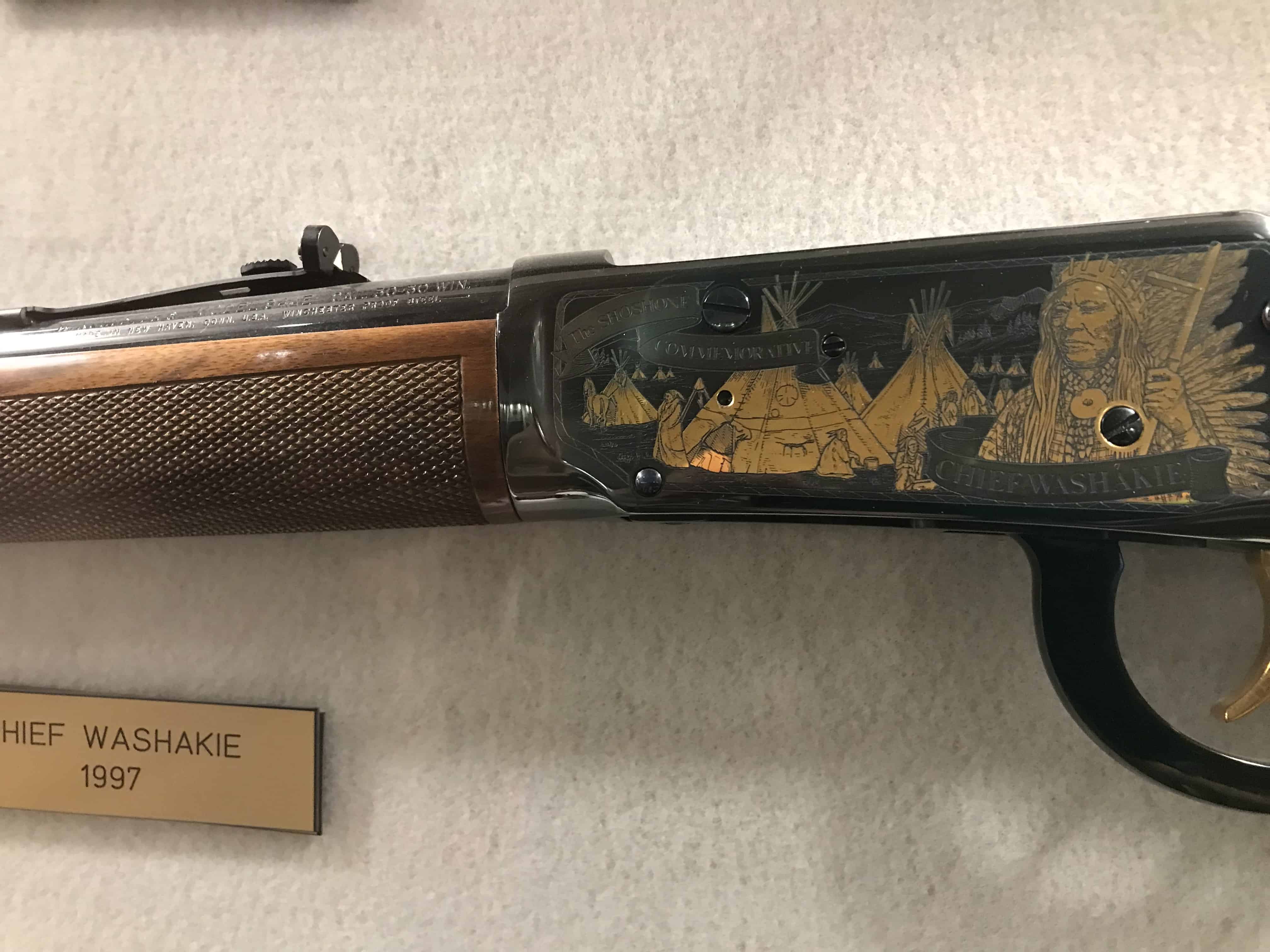 Decorative scene on rifle handle