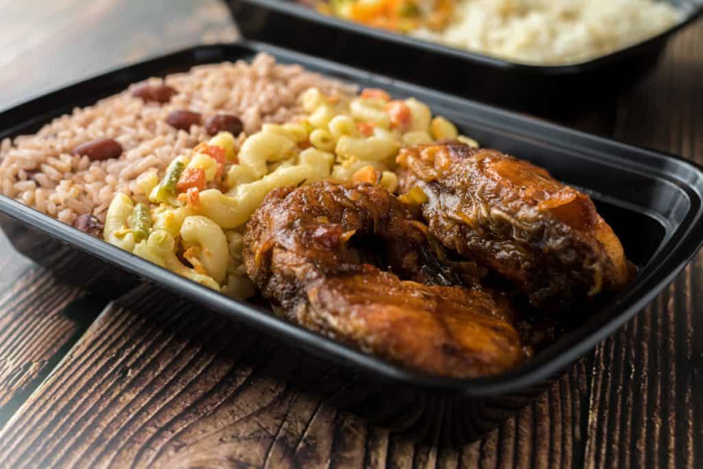 Barbecue chicken with rice and peas and macaroni salad box lunch. A similar meal would have been served at Bible conference in Cottage, Jamaica. 