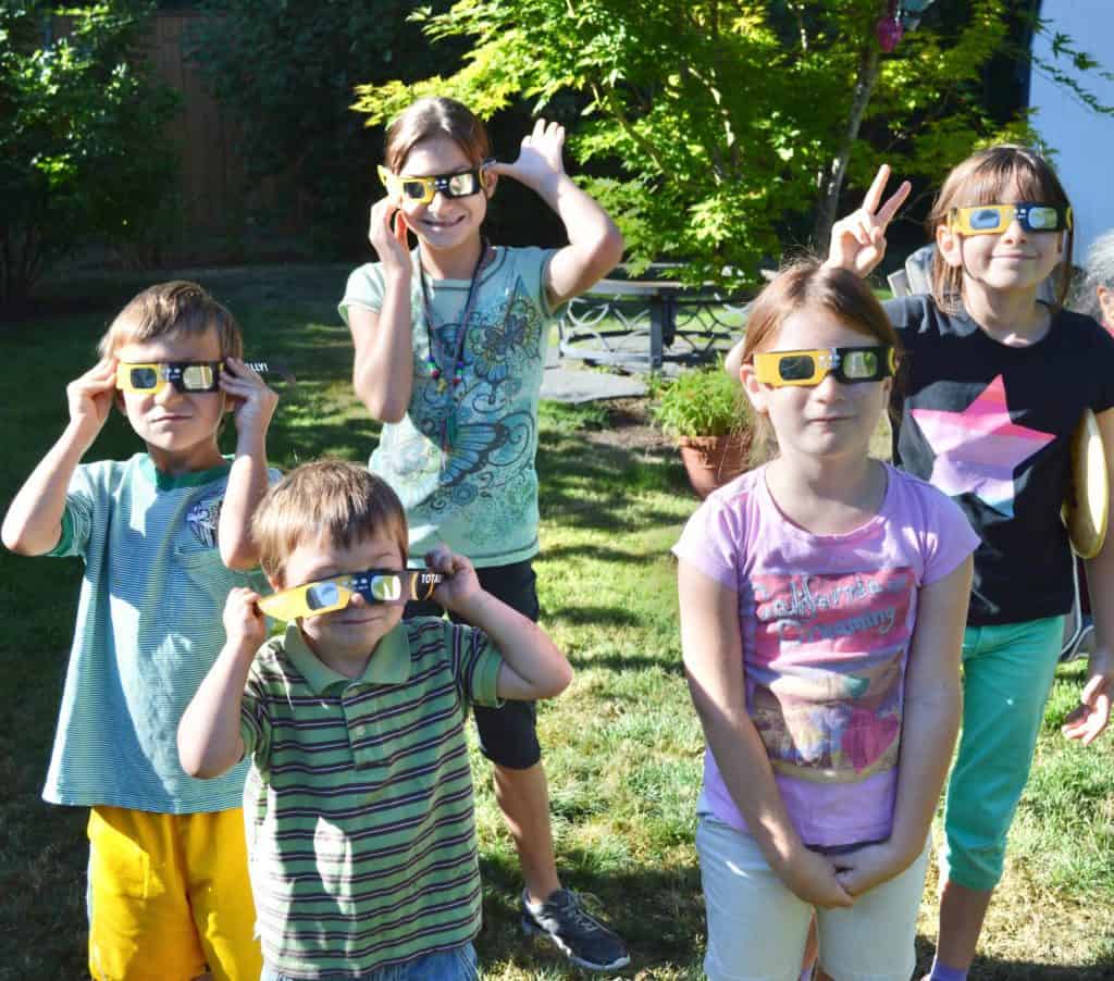 five kids wearing eclipse glasses. ADHD timers and tips for time blindness. 