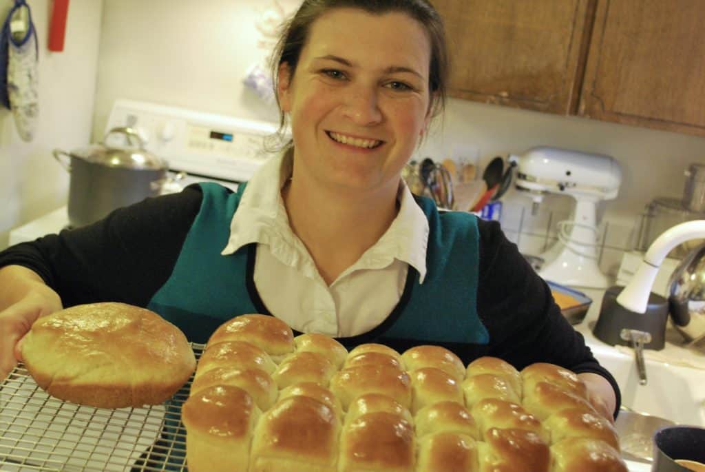 woman holding homemade bread rolls