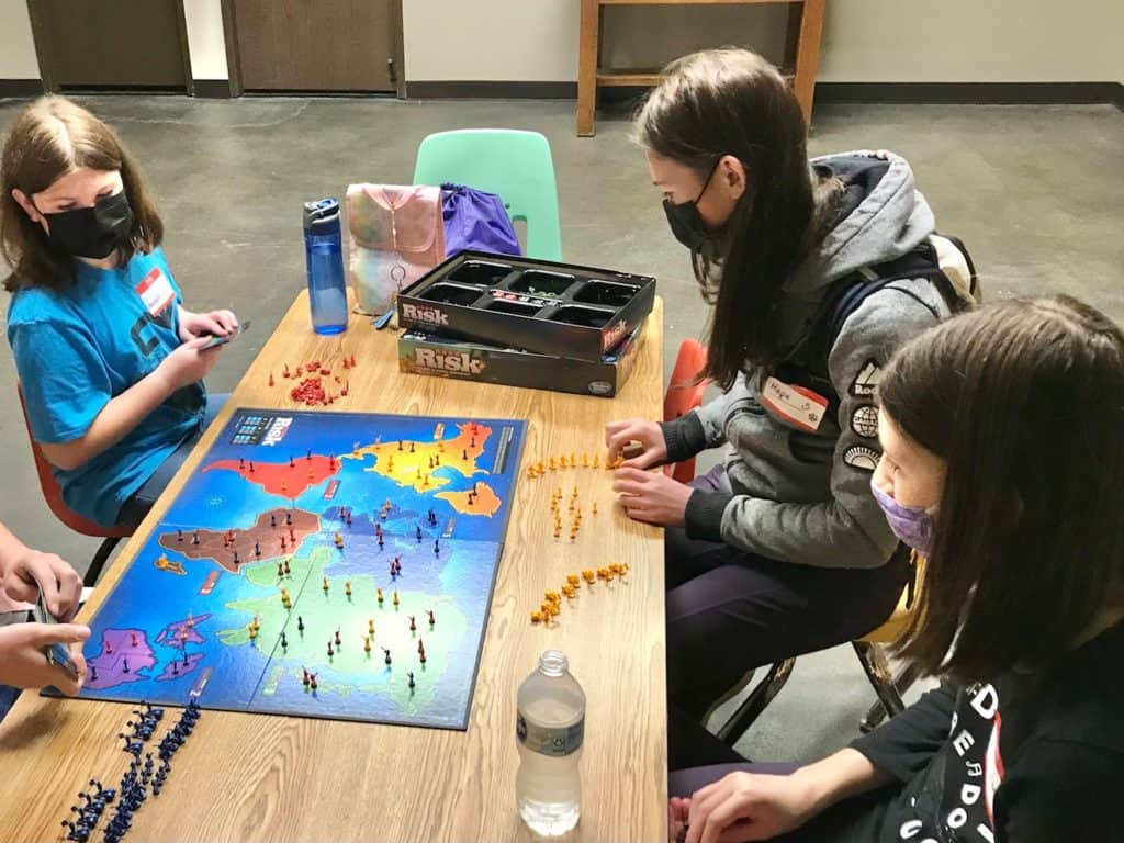 Kids playing a board game. gifts for kids