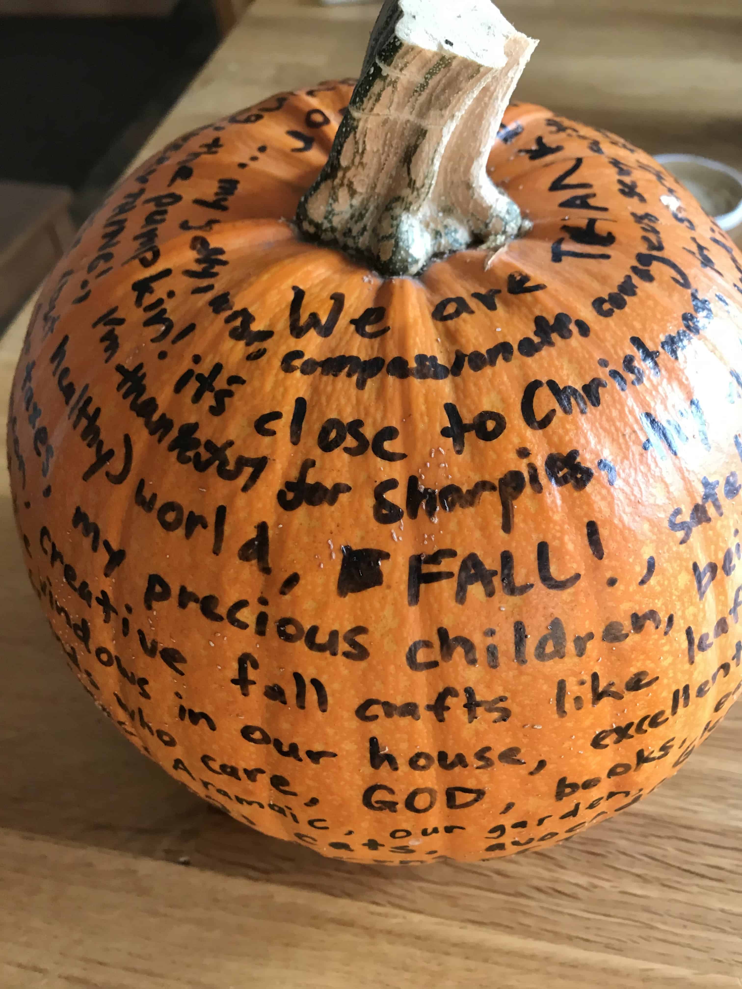 pumpkin with black lettered list of thankful things
