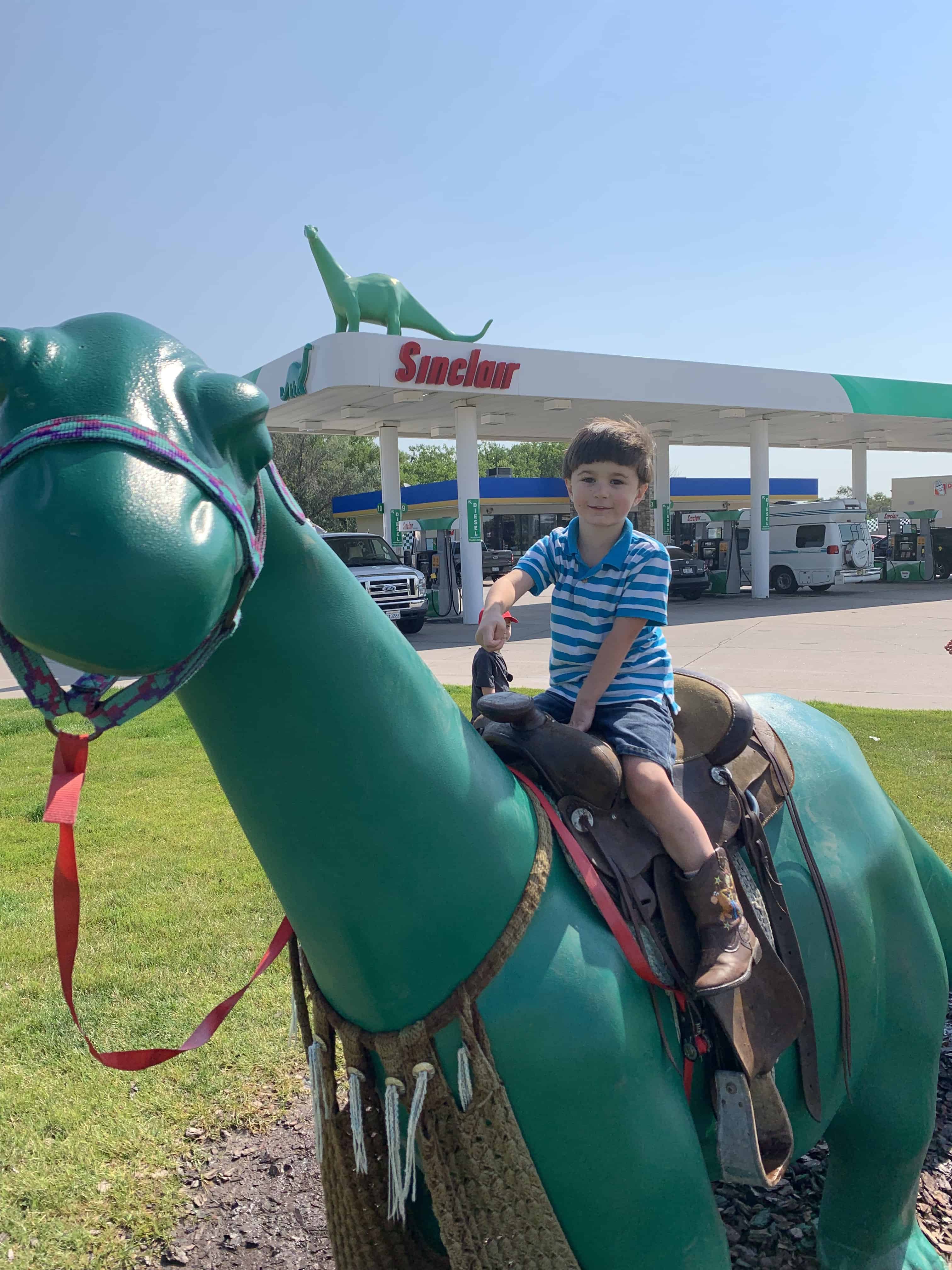 boy on Sinclair dinosaur