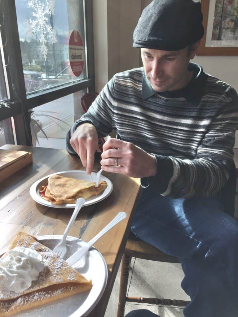 man eating crepe at table ADHD time blindness