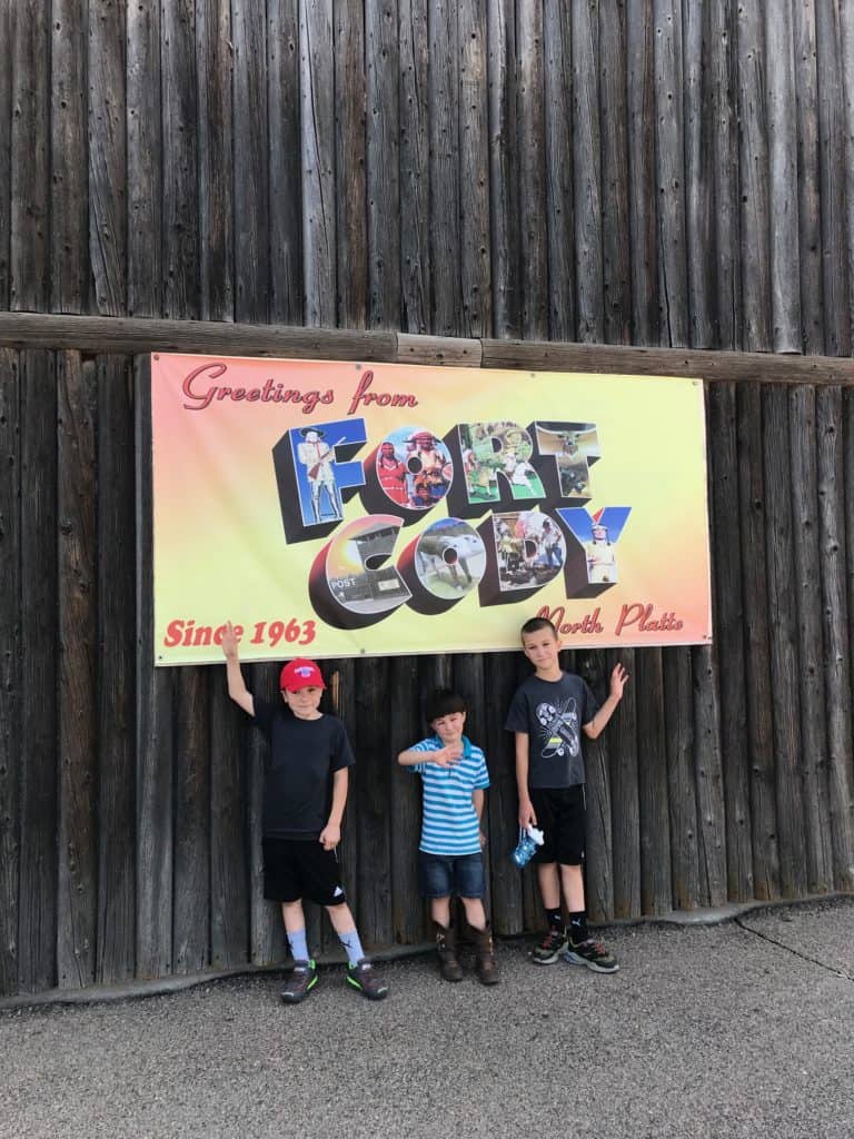 Boys in front of Fort Cody Post Card