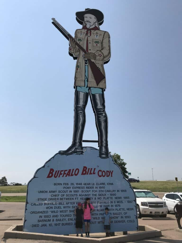 Our kids in front of the Buffalo Bill Cody giant cutout at the Fort Cody Trading Post in North Platte, Nebraska