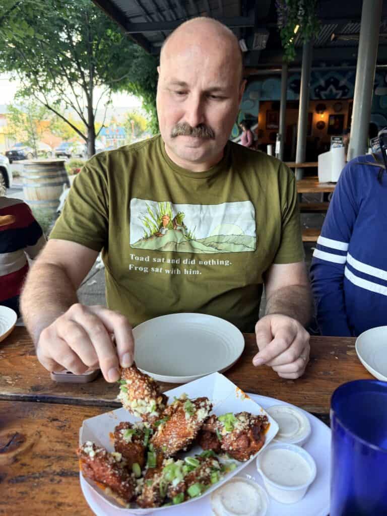 Brian is eating dinner here, but ADHD time blindness often causes him to forget regular mealtimes until hunger overwhelms his senses.