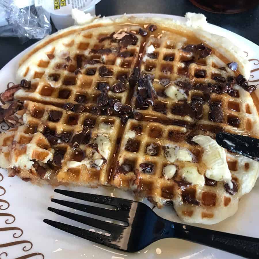 Waffle House hot signature waffle with melted butter, syrup and melted chocolate chips.