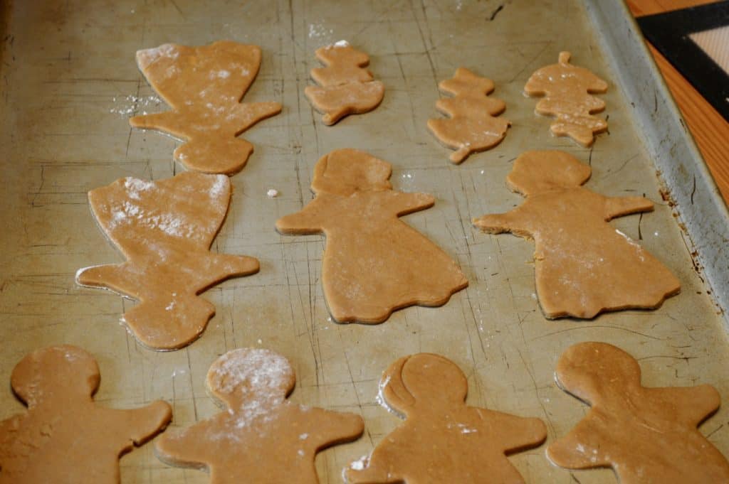 uncooked gingerbread cookies on baking sheet