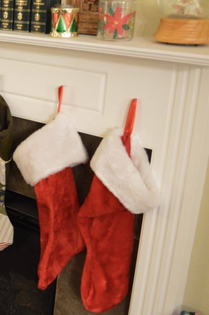 stockings hanging on mantel. little red and green drums received as a present for Christmas in Jamaica.