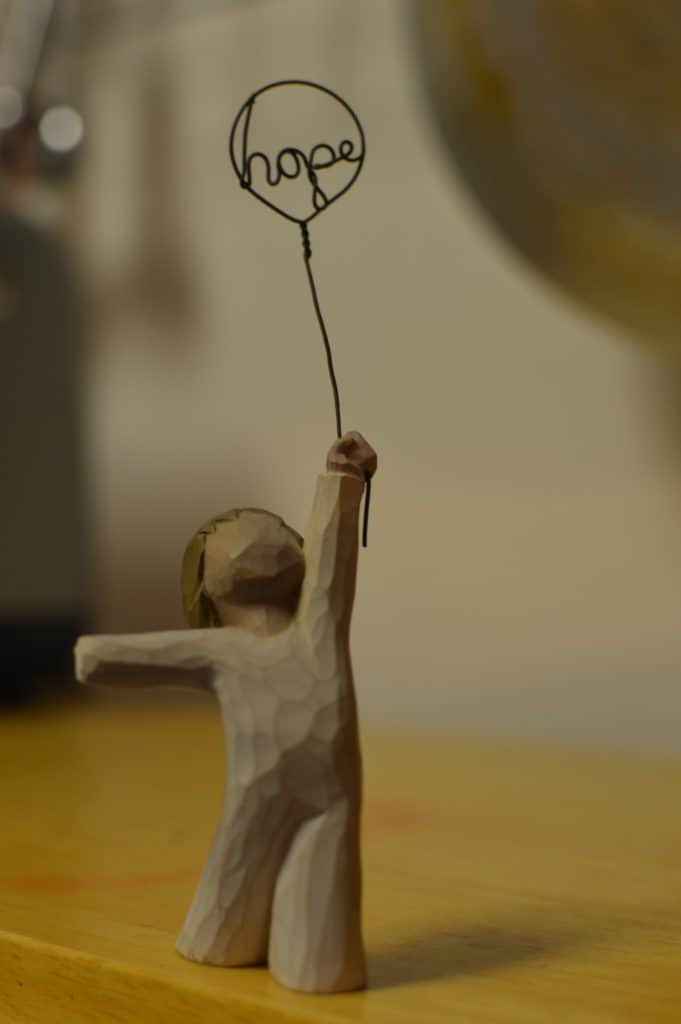 willow tree figurine with balloon that says "hope"