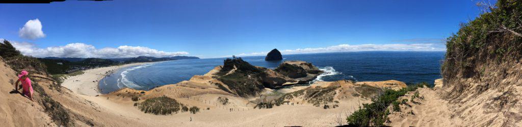 Panoramic shot of Cape Kiwanda and Pacific City from the cape's high dune. Don't miss visiting Pacific City Oregon with kids!