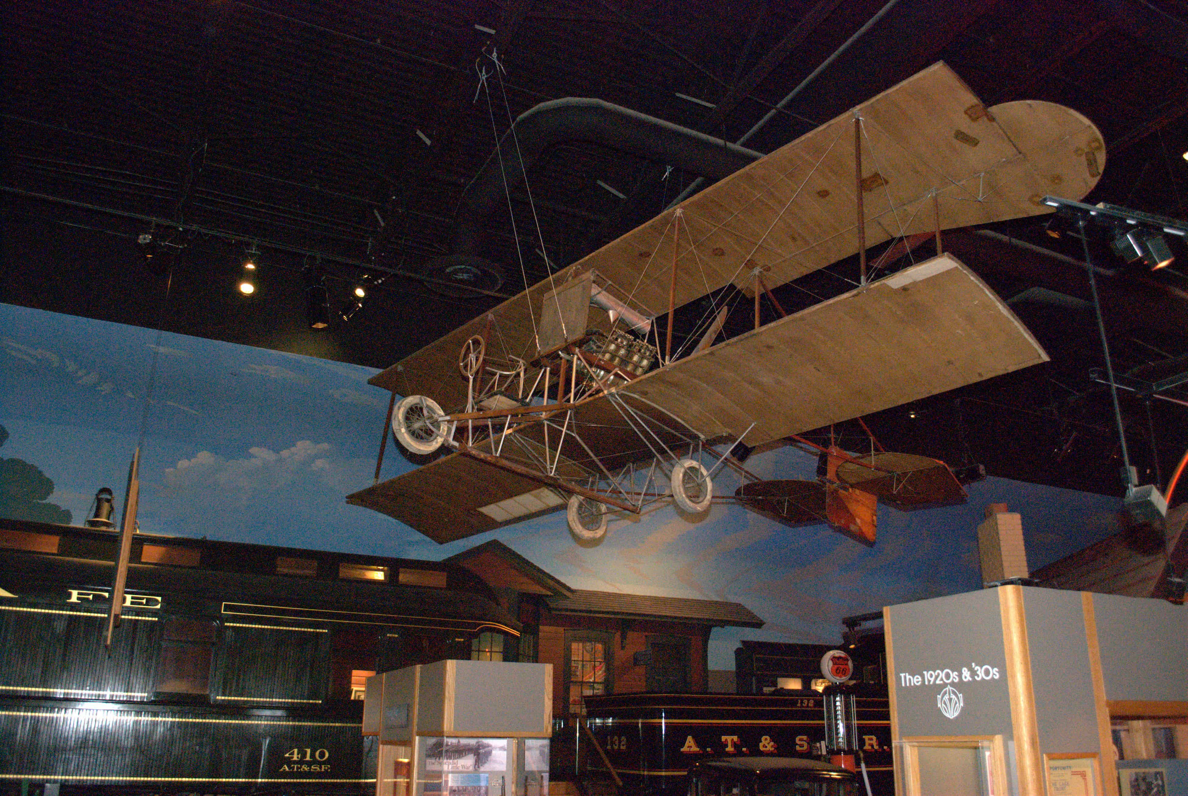 An early airplane and a steam locomotive are on display at the Kansas Museum of History.