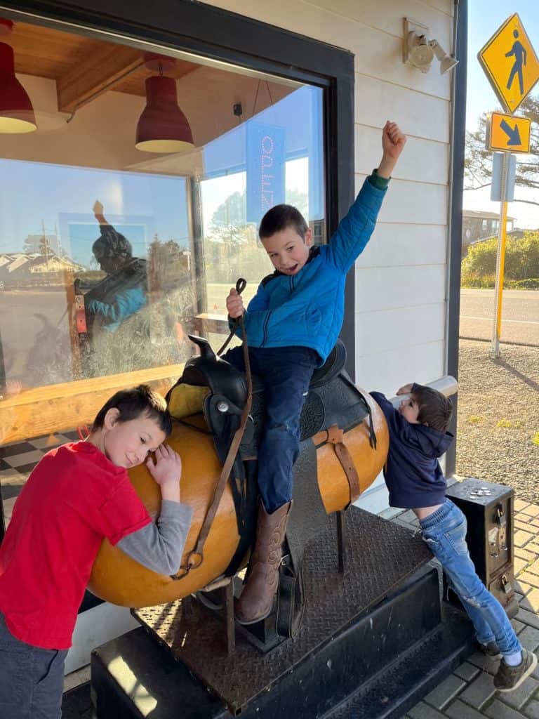 Boys riding corn dog ride at Pronto Pup