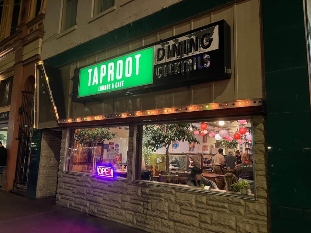 Taproot's exterior at night.