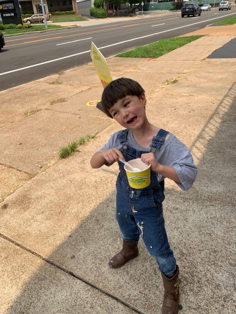 Little boy smiling while eating Ted Drewes frozen custard