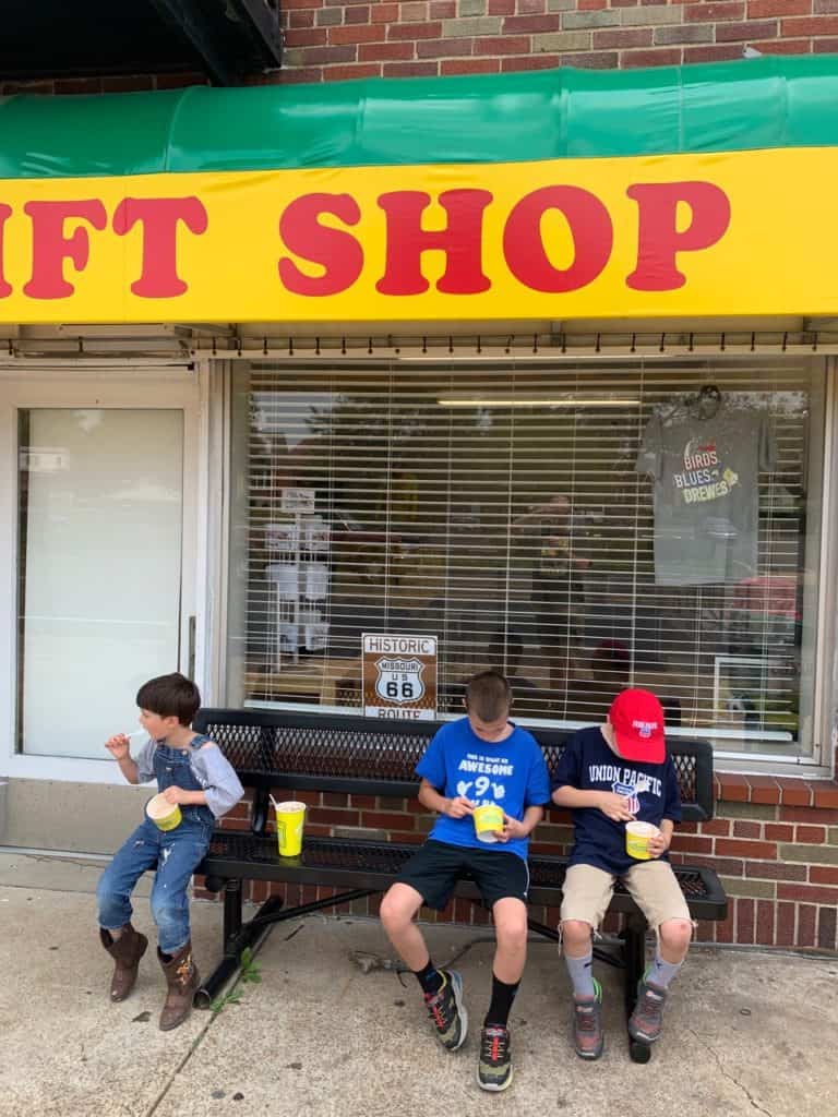 Boys eating frozen custard outside the Ted Drewes gift shop