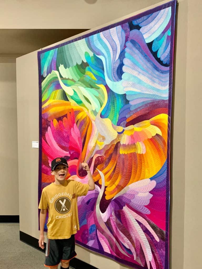 Beautiful rainbow colored quilt of different birds. National Quilt Museum, Paducah, Kentucky.