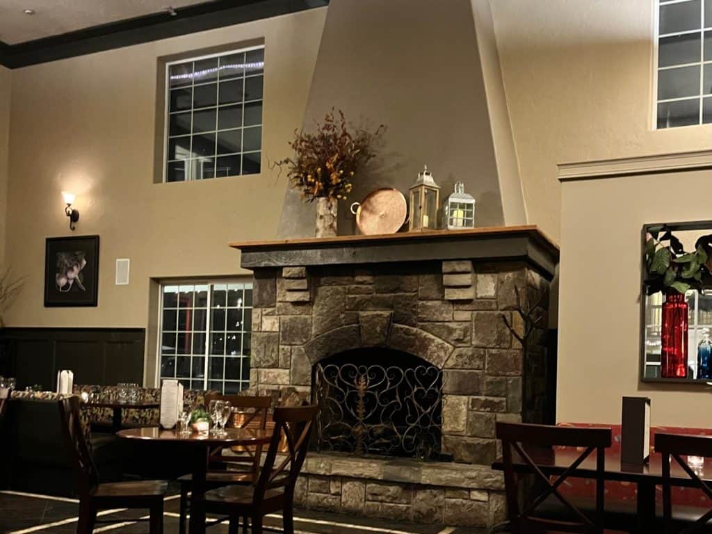 Stone fireplace in the dining room at the Magnolia Grill