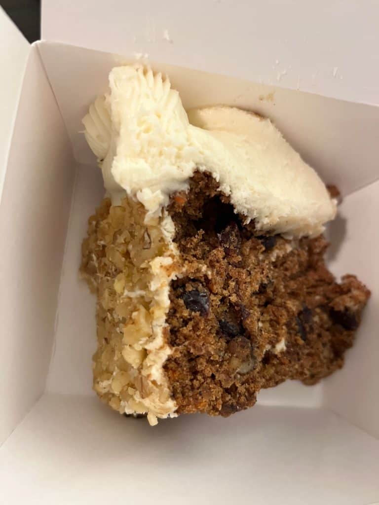 Carrot cake in a to go box from the Magnolia Grill.