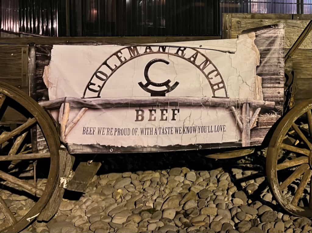 Coleman Ranch sign on old covered wagon base