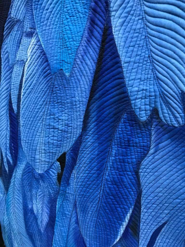 Details of blue Macaw feathers on a quilt in the National Quilt Museum, Paducah, Kentucky.