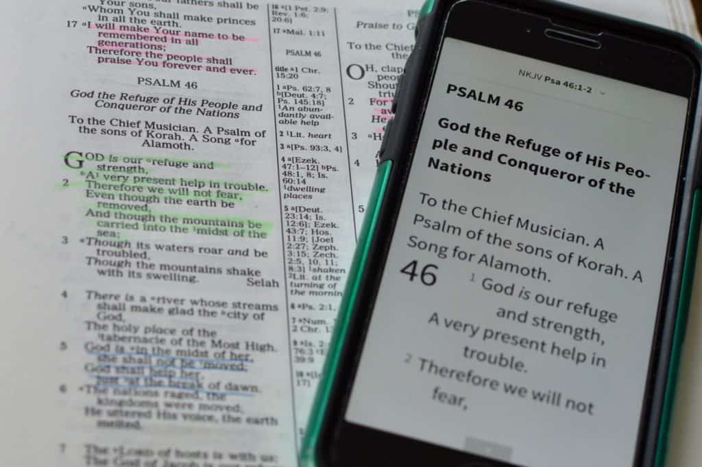 Bible with Psalm 46 in focus. Phone on top of Bible showing Psalm 46. Meditation is one of the best self care ideas for anxiety.
