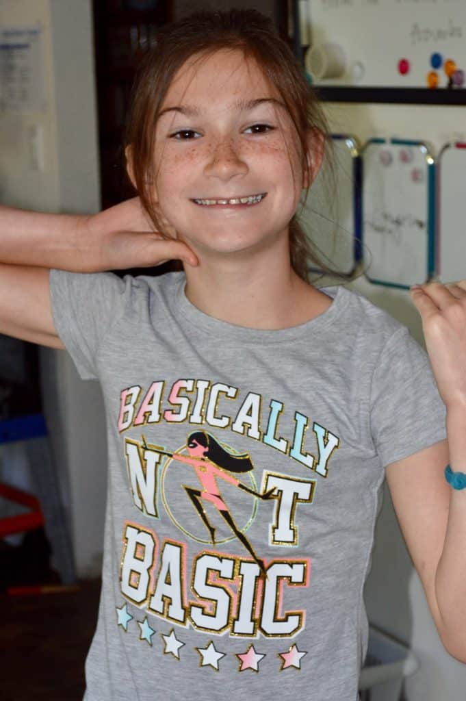 Girl wearing shirt that says, "Basically not Basic". An ADHD diagnosis can be particularly helpful for girls with hyperactive type ADHD.