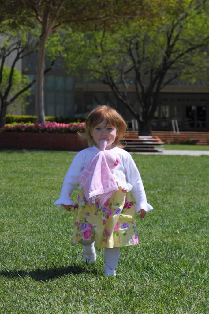 Toddler girl in fancy dress and clothes. Gender stereotypes make it especially difficult for girls with some types of ADHD to feel accepted.