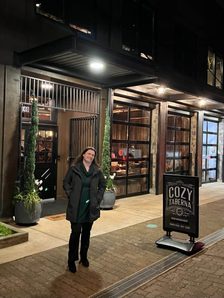 Woman outside the Cozy Taberna (tapas restaurant) in Salem, Oregon.