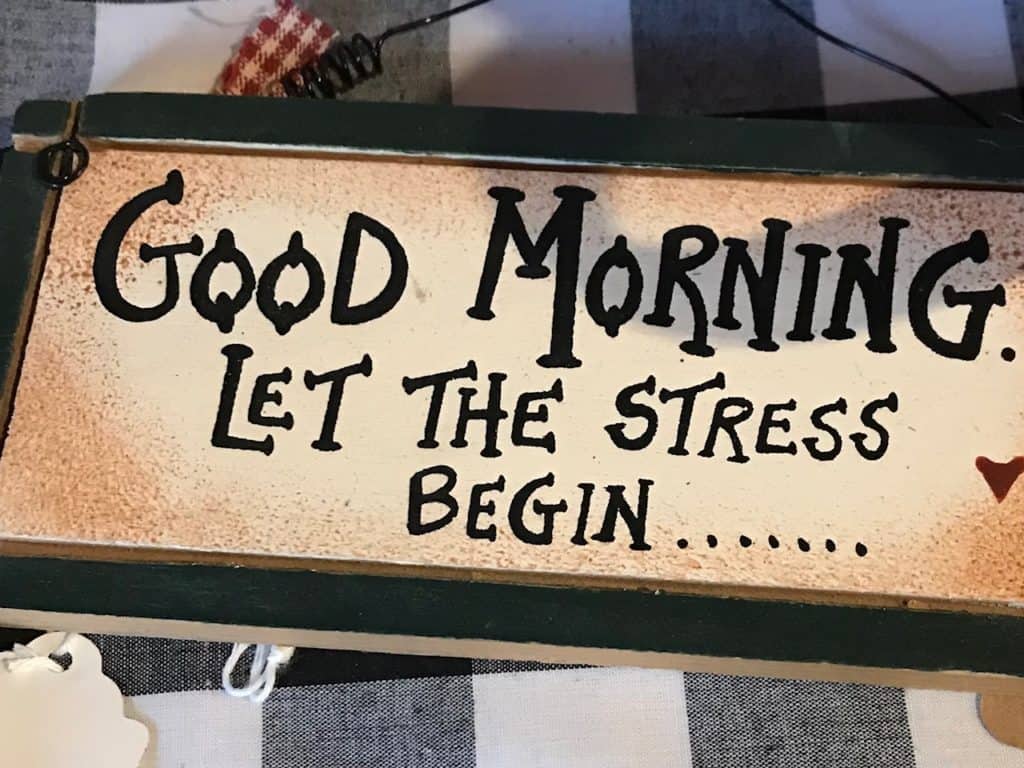 Hand painted sign says, "Good Morning, let the stress begin". Overbooking is common for hyperactive/ impulsive types of ADHD.