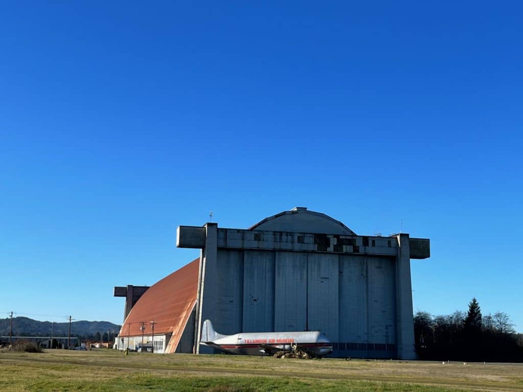 Front view of Hangar B at the Tillamook Air Museum, with the Guppy aircraft outside.