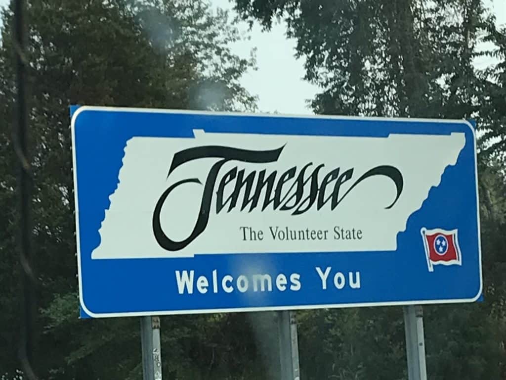 Welcome to Tennessee sign. The Nashville Parthenon is a famous landmark of Tennessee.