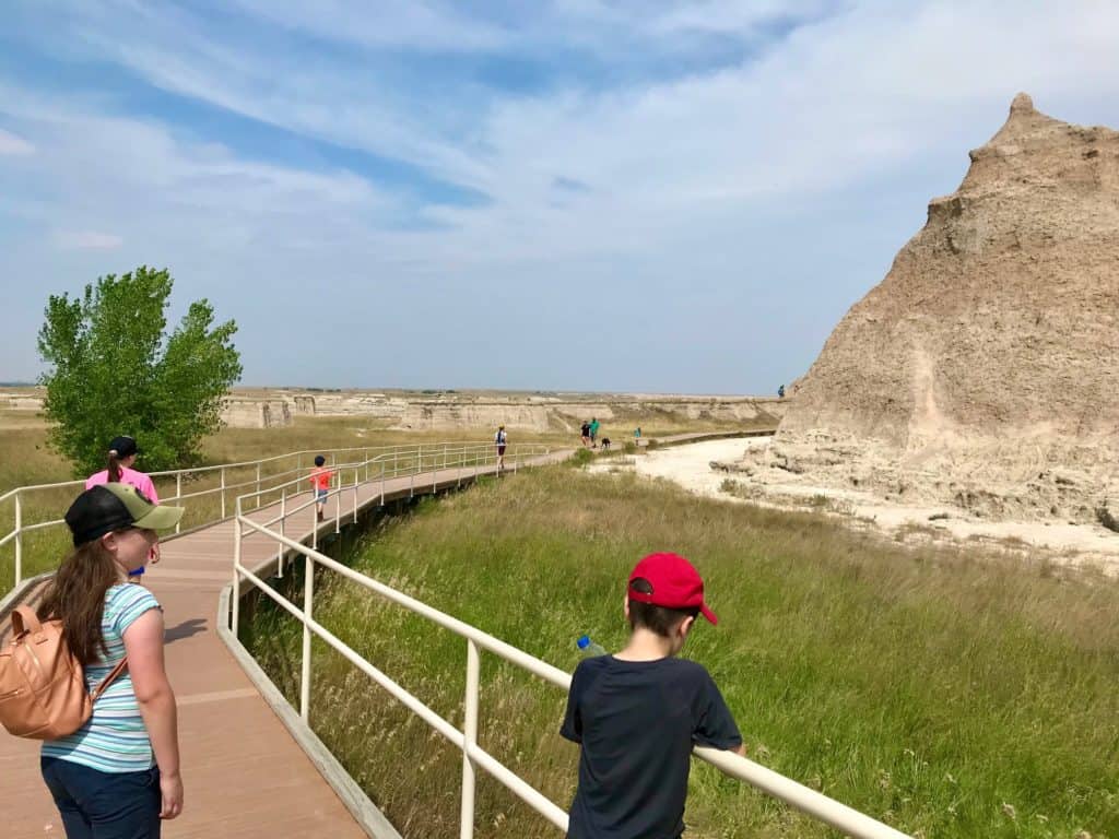 Boardwalk leading to trail. There are several parking lots to park and take a short walk while driving through Badlands National Park.