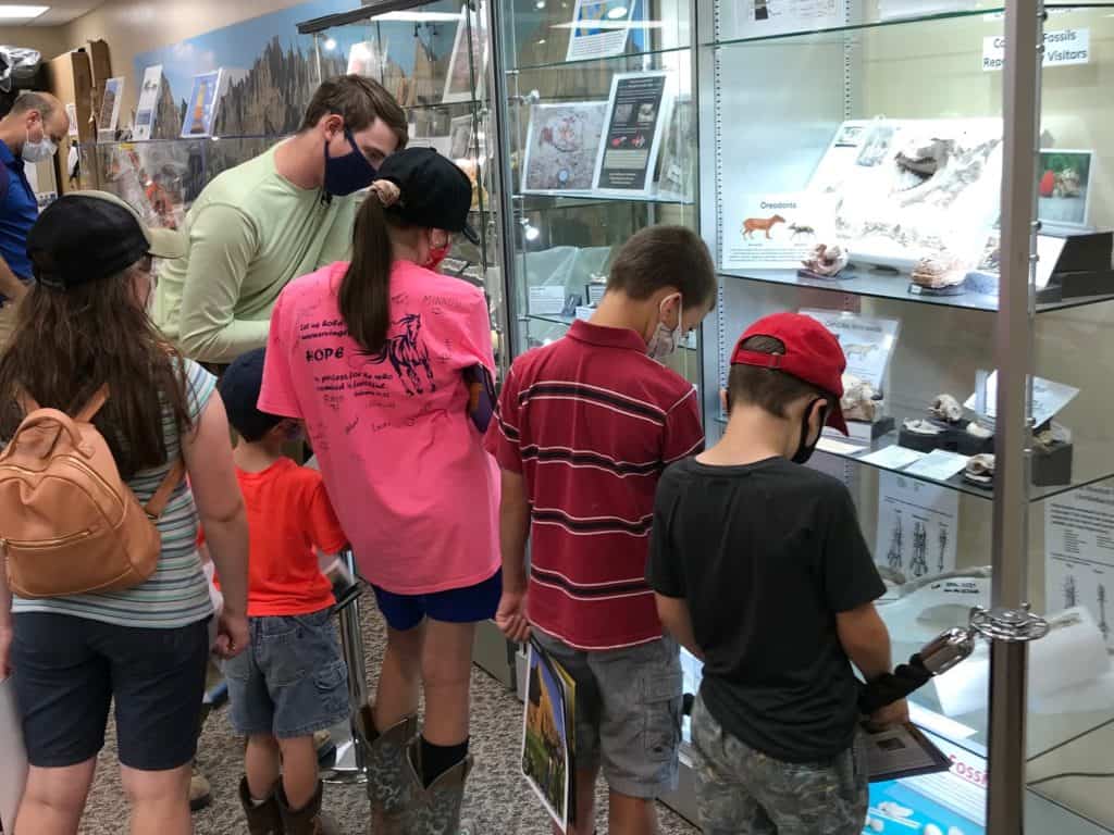 Paleontologist answering kids questions at the fossil lab.