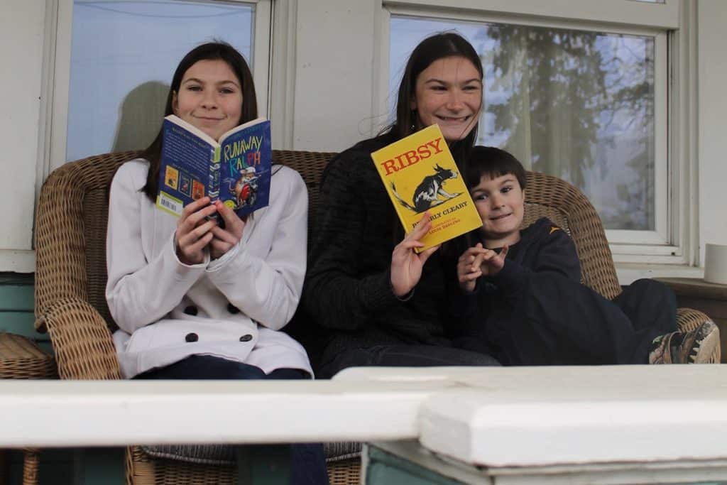 Girls and boy reading Beverly Cleary books. 