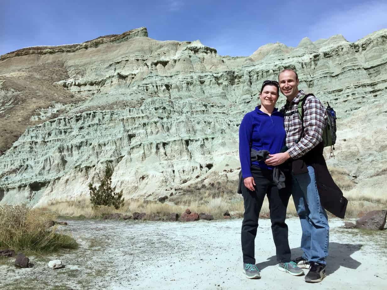 Couple standing in front of Blue Basin formation.