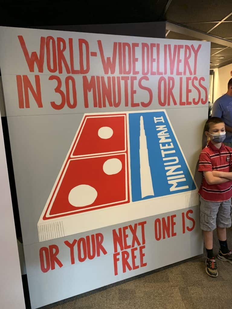 My grade-school age son stands in front of a display at MInuteman Missile NHS. 