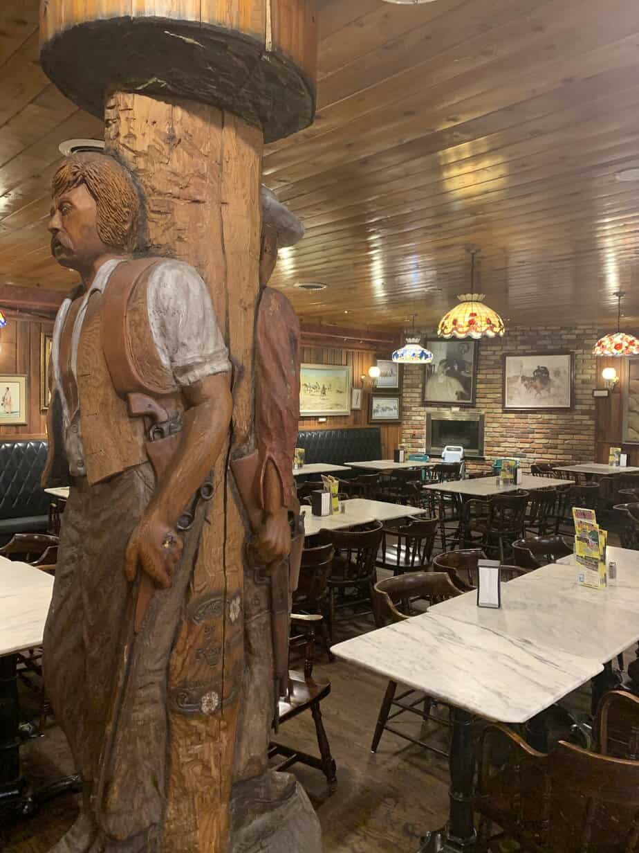 Giant carvings and art in the Wall Drug Western Art gallery dining room. Wall Drug is the most well known of the restaurants in Badlands National Park.