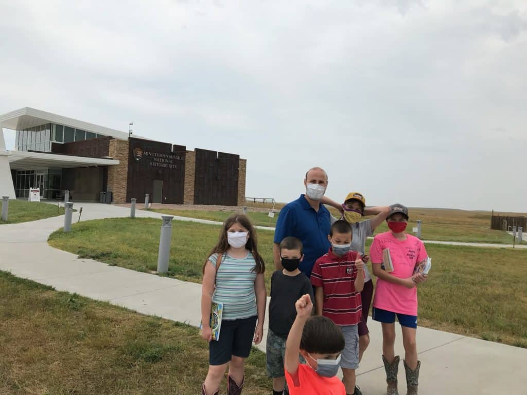 Me and my six children stand at the entrance of the Minuteman Missile National Historic Site Visitor Center. It's not obvious from the photo, but I was right in the midst of a panic attack.