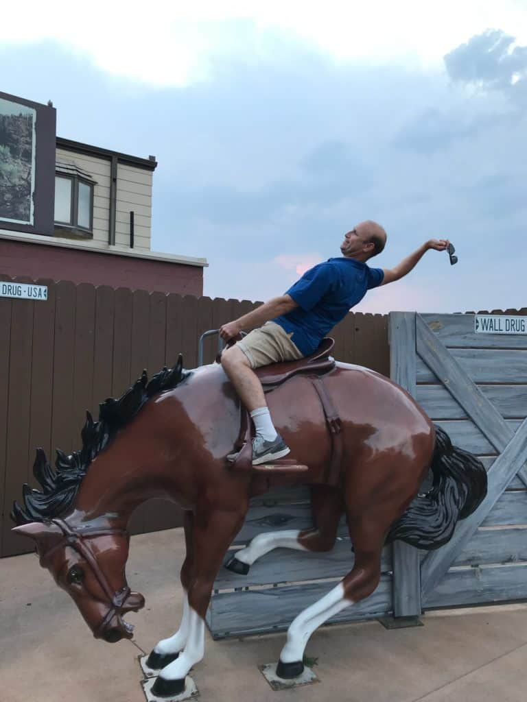 man on bucking bronco statue