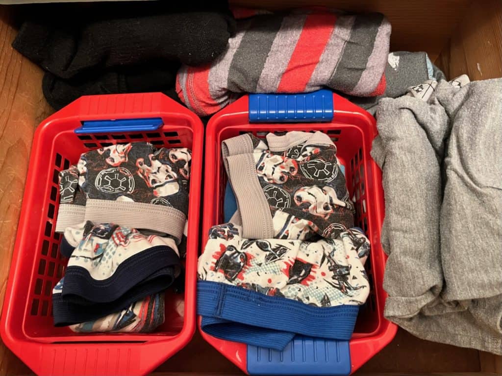 Neatly organized kids storage in a drawer. Making things accessible and easy to keep neat is one of the best kids clothing organization ideas.