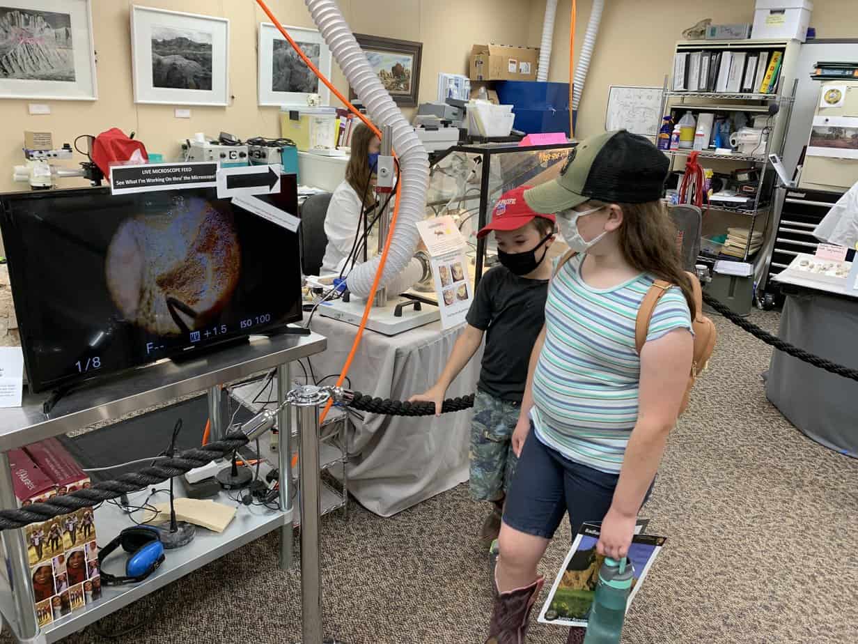 Kids inside the paleontology lab at the Ben Reifel Visitor Center in Badlands NP. The Visitor Center is right next to Cedar Pass Lodge.