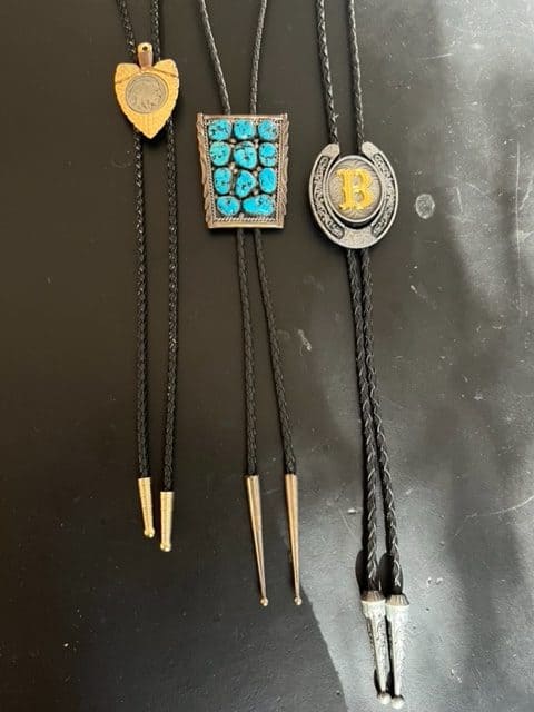 Three bolos that I own. Two are antique bolos and one is an inexpensive Amazon bolo that I don't mind risking in the everyday toils of life. cowboy gifts for men
