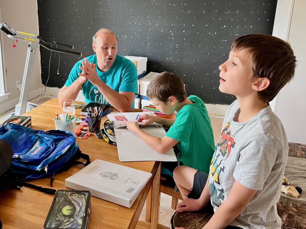 Brian and our sons talking about homeschool year plans