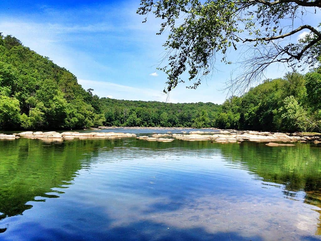 The gentle waters of the Chattahoochee River flow beside the forested hills of North Georgia. Chattahoochee NRA is one of the 12 best National Parks in Georgia.