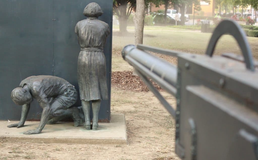 Disturbing statues of unarmed Black people with a gun pointed at them. Birmingham Civil Rights National Monument in Alabama. Image courtesy of NPCA photos.